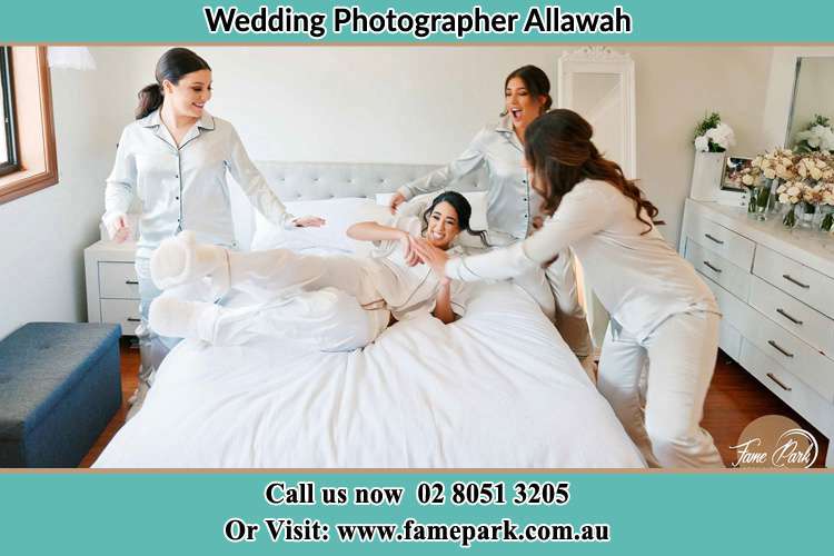 Photo of the Bride and the bridesmaids playing on the bed Allawah NSW 2218