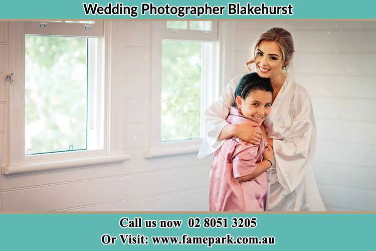 Photo of the Bride hugging the flower girl Blakehurst NSW 2221