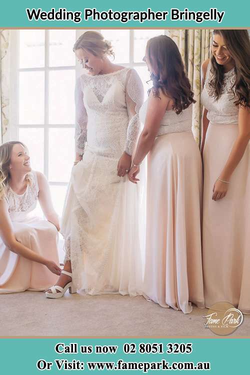 Photo of the Bride assisting by her bridesmaids Bringelly NSW 2556