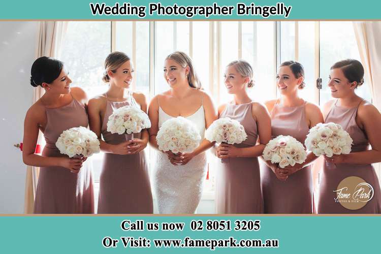 Photo of the Bride and the bridesmaids holding flower bouquet Bringelly NSW 2556