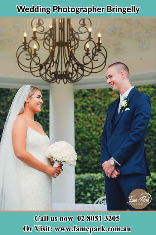 Photo of the Bride and the Groom happily looking each other Bringelly NSW 2556