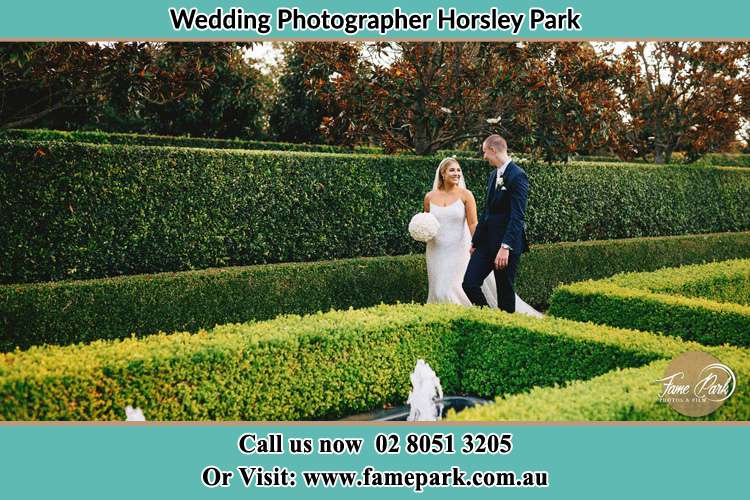 Photo of the Bride and the Groom walking at the garden Horsley Park NSW 2175