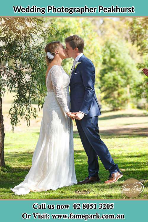 Photo of the Bride and the Groom kissing at the yard Peakhurst NSW 2210