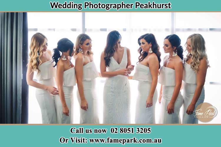 Photo of the Brides with her bridesmaids looking at her Peakhurst NSW 2210