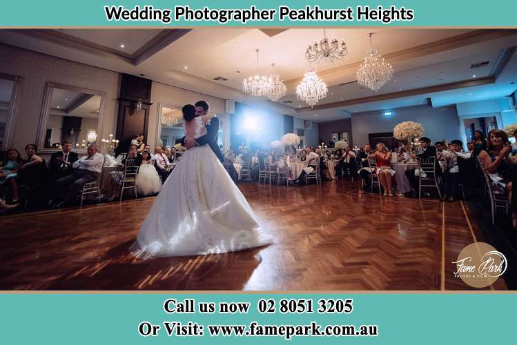 Photo of the Bride and the Groom hugging on the dance floor Peakhurst Heights NSW 2210