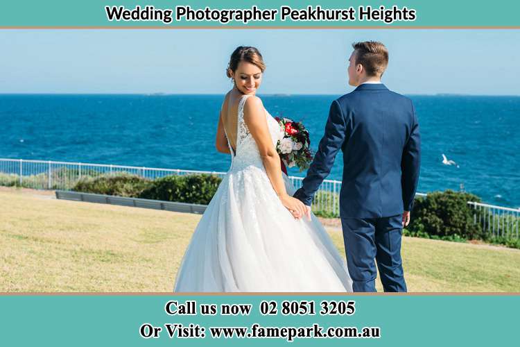 Photo of the Bride and the Groom holding hands at the yard Peakhurst Heights NSW 2210