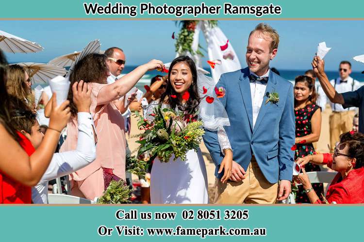 Photo of the Bride and the Groom showering flower petals by the visitors Ramsgate NSW 2217